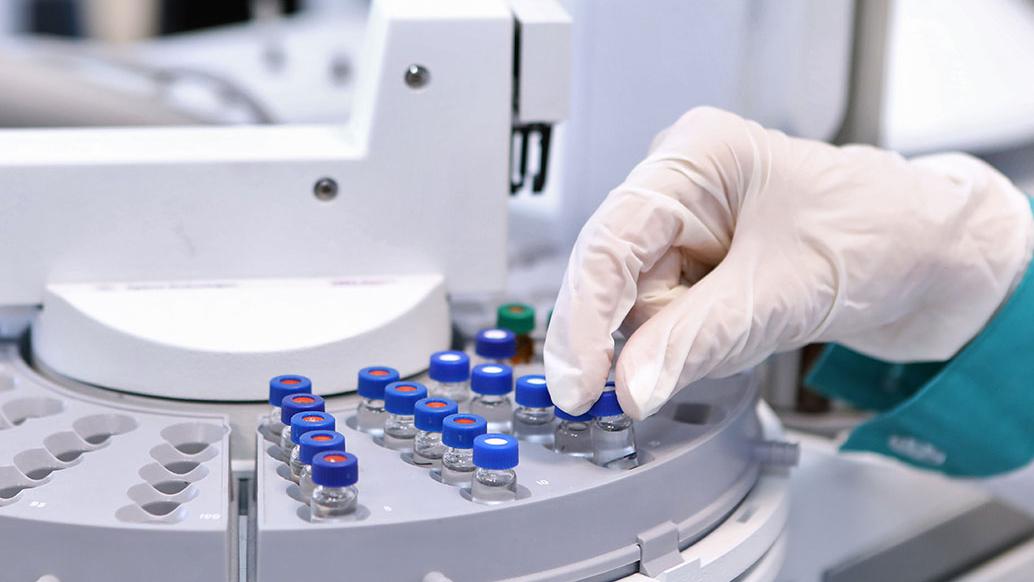 Quality Control Laboratory medicine. High Pressure Liquid Chromatography operation. A woman makes an analysis on a gas chromatograph.