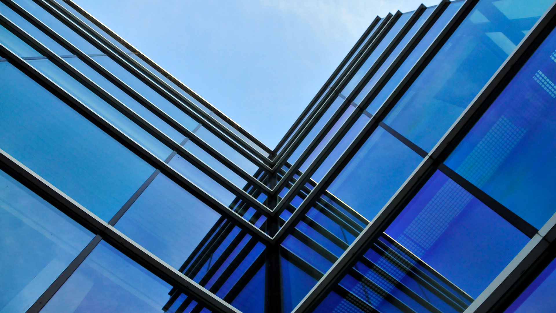 glass facade skyscraper with blue electrochromic glass