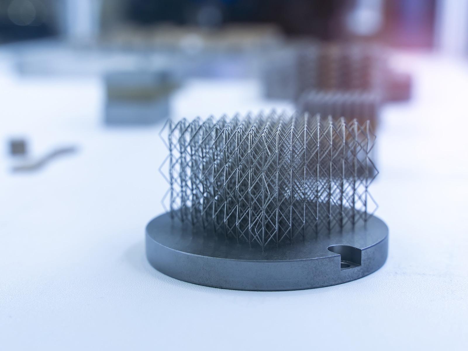 Close-up of object printed on a 3D metal printer.