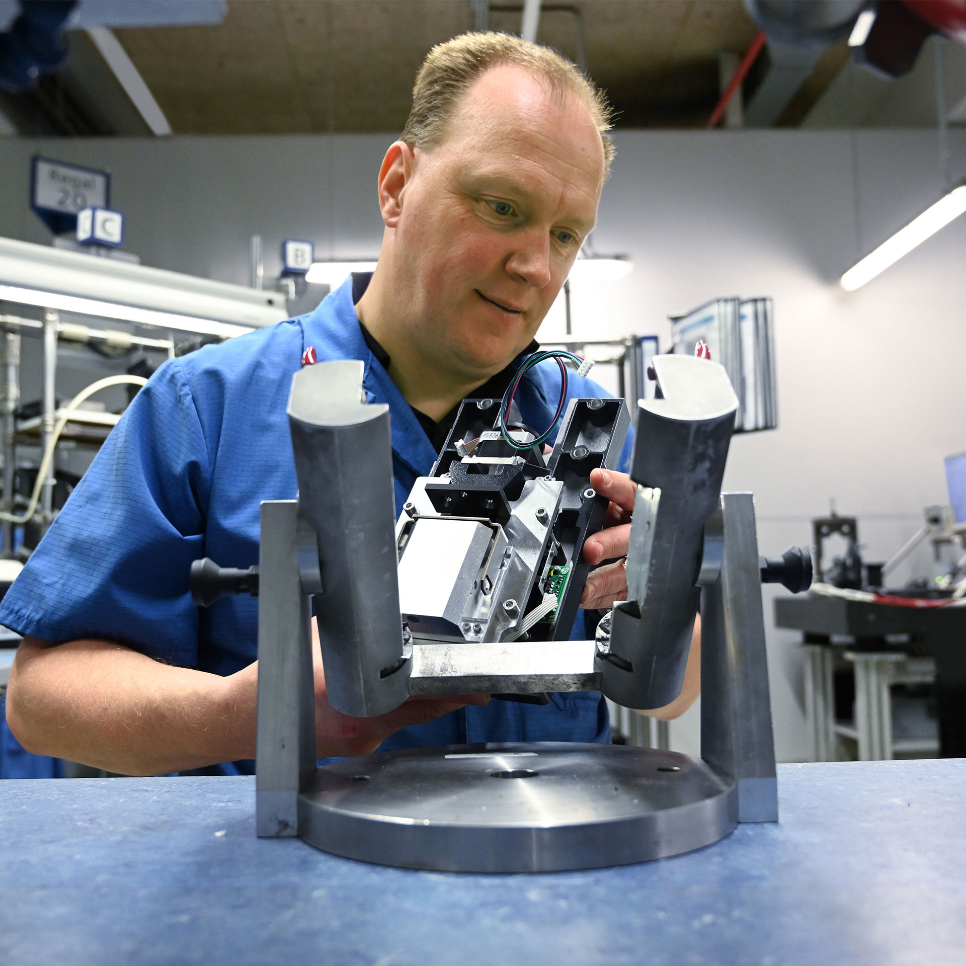 Person inspects a mechatronics assembly