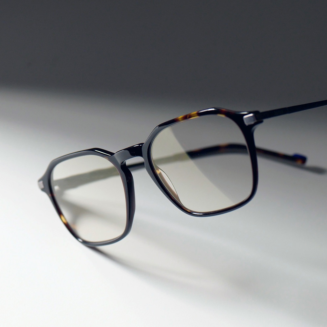 Image of glasses with gray background.