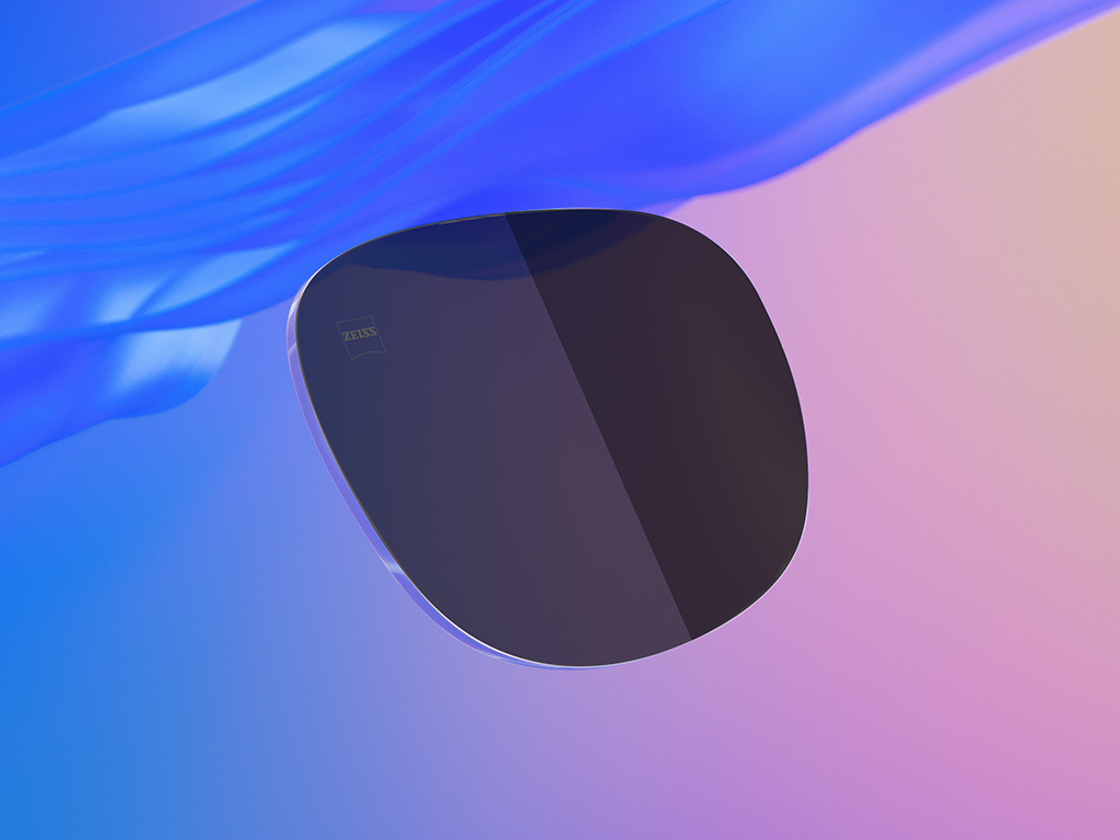 3D CGI illustration of a tinted sunglass lens, one half showcasing a lighter darkness-level than the other.