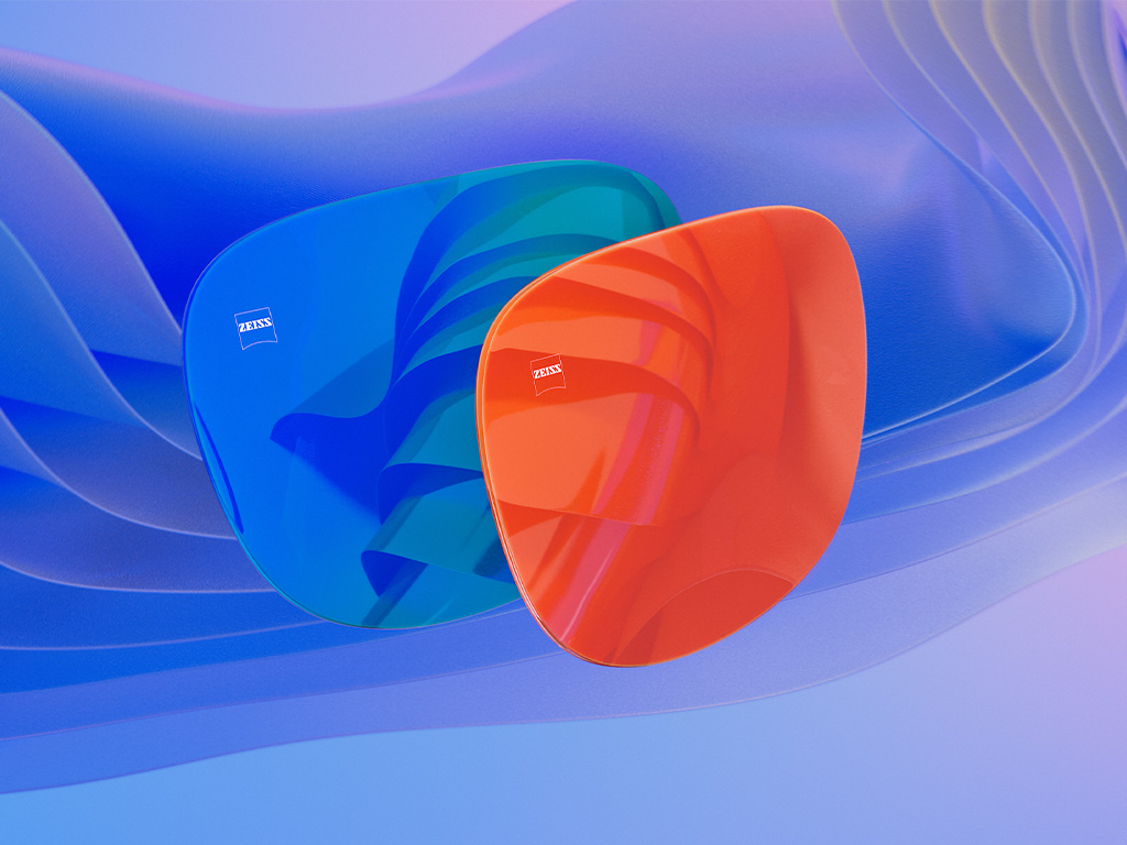 3D CGI illustration of two sunglass lenses with a blue and an orange mirror coating.