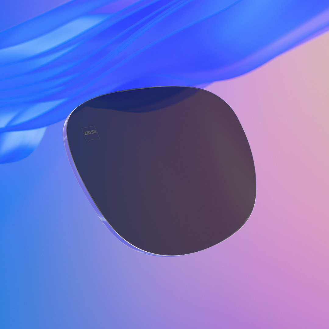 A slider image where one half shows an intensely tinted ZEISS prescription sunglass lens and one half showing the same less but less intensely tinted.