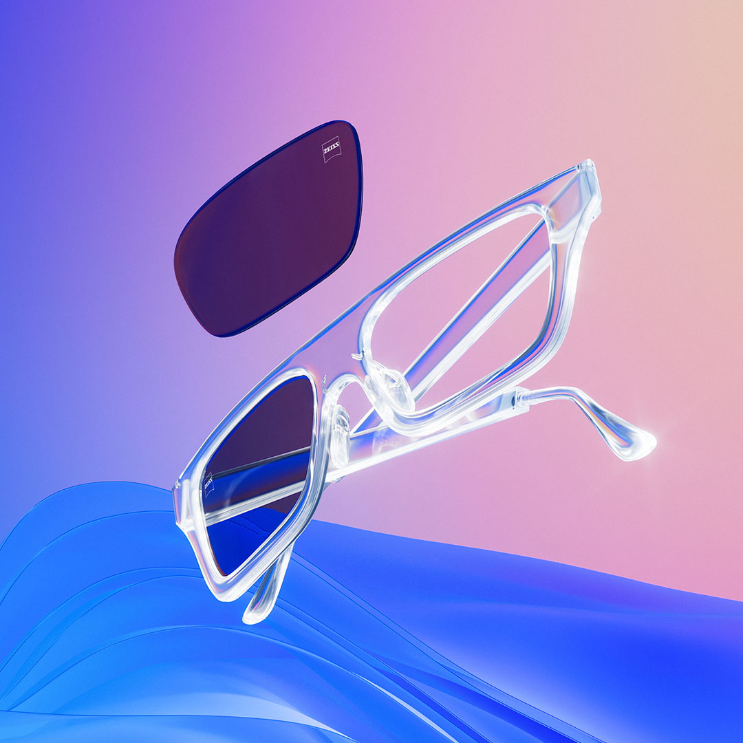 3D CGI illustration of a clear eyeglass frame with tinted lenses.
