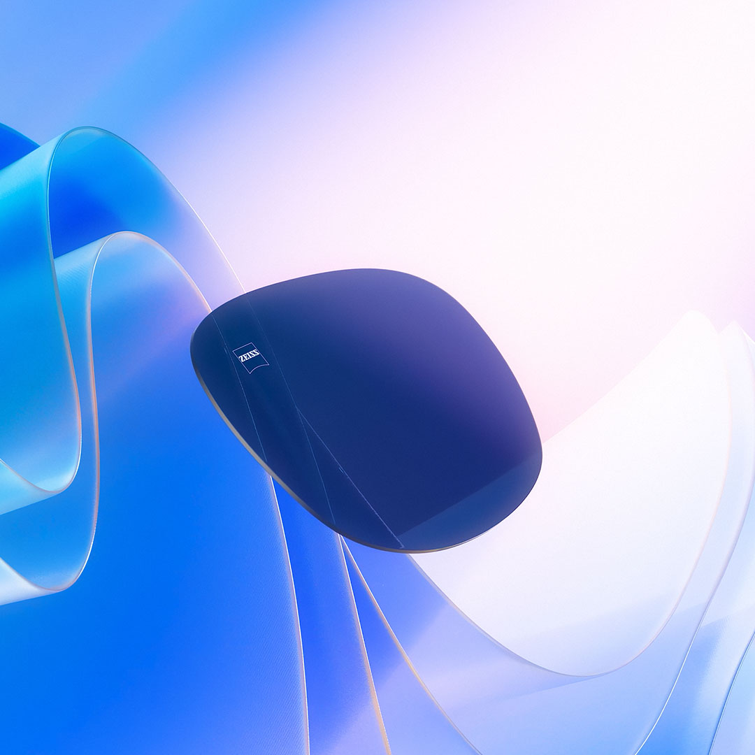 3D CGI illustration of a tinted lens floating towards a light source, effectively blocking harmful UV rays.