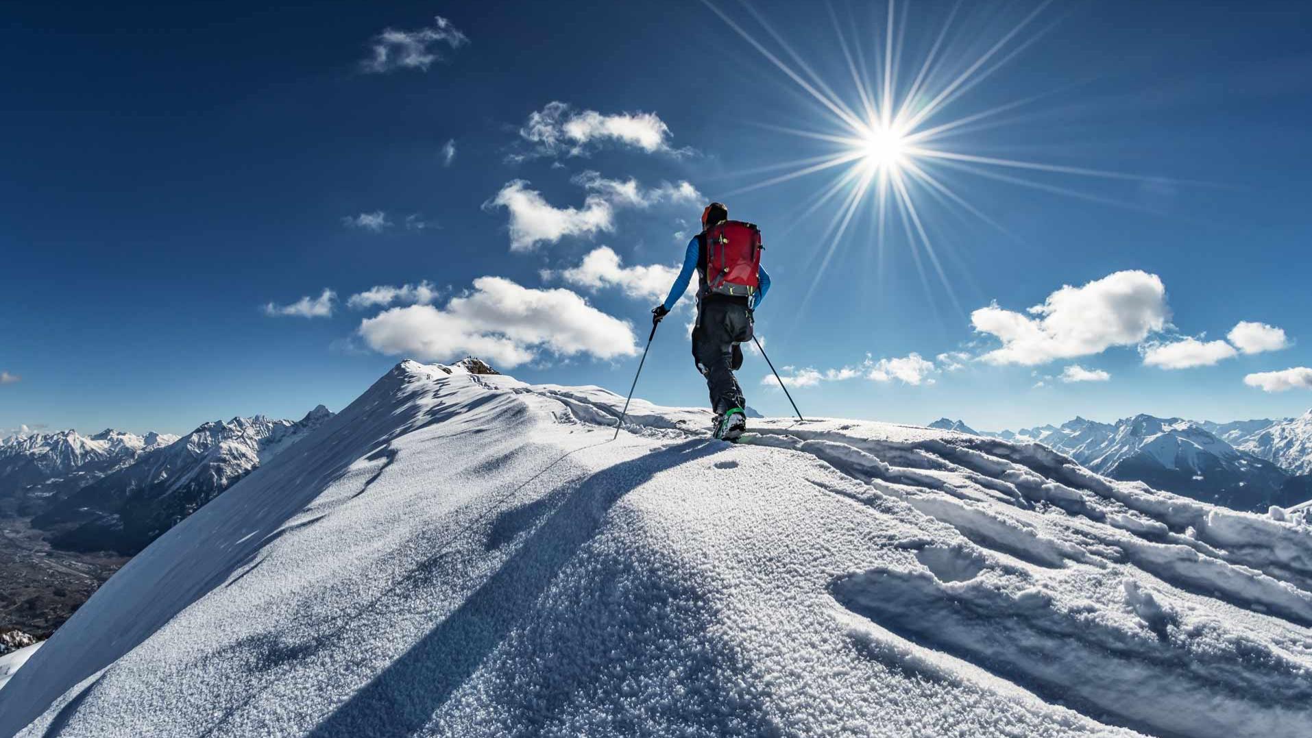 Image illustrating a person skiing in very intense solar conditions