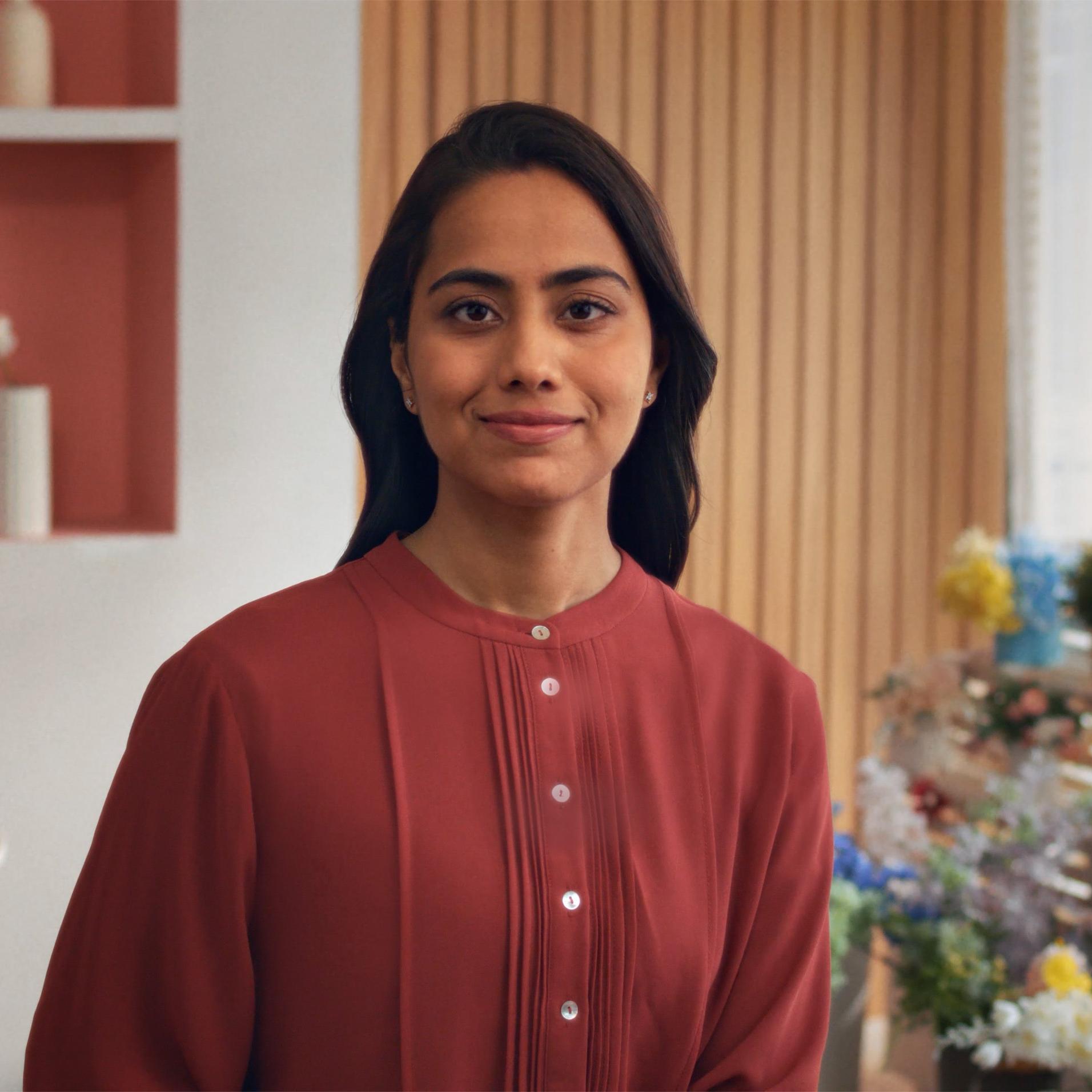 Woman standing indoors with a calm expression, representing patient preparation and confidence before PRK surgery.