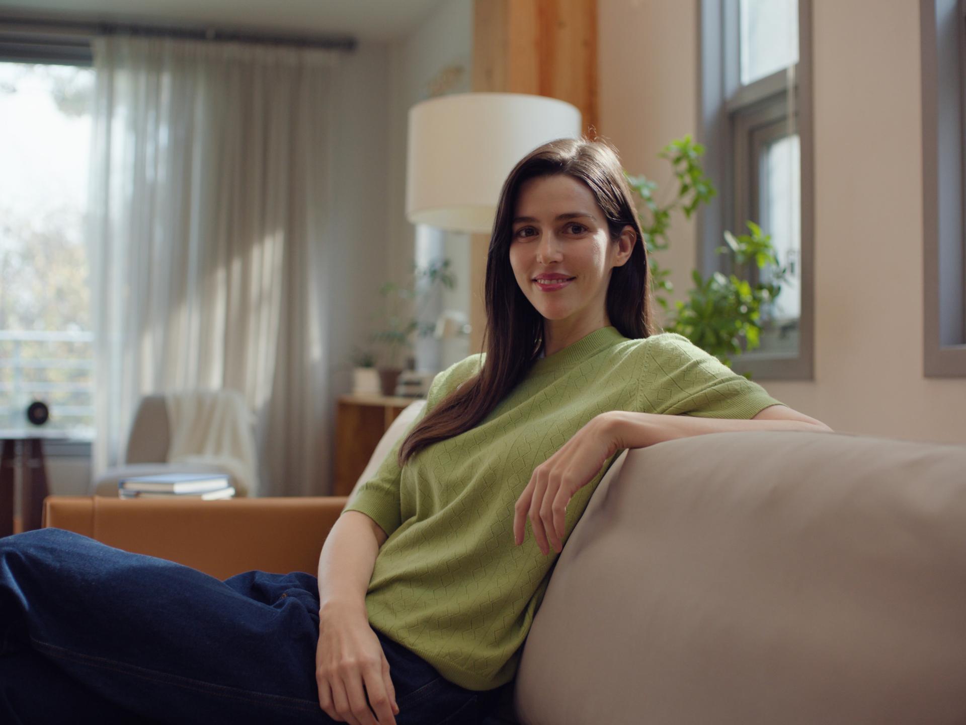 A smiling patient looking into the distance, symbolizing satisfaction and visual clarity after ZEISS SMILE surgery.