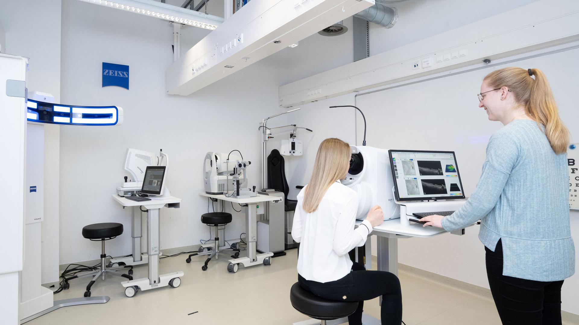 Female scientist working on an optical instrument