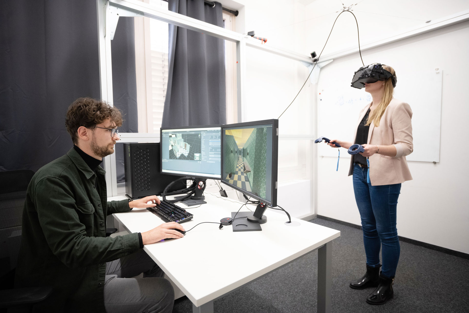 Women with VR glasses. Male scientist sitting in monitor,