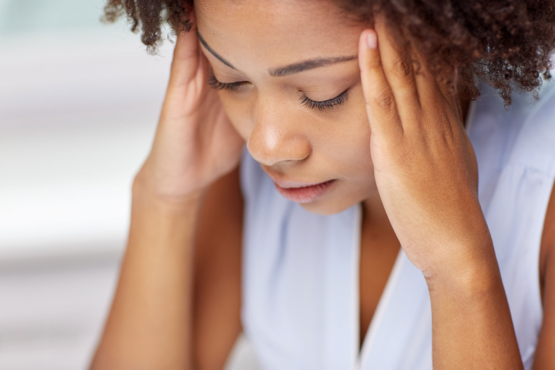 Why can vision problems be the cause of headaches?