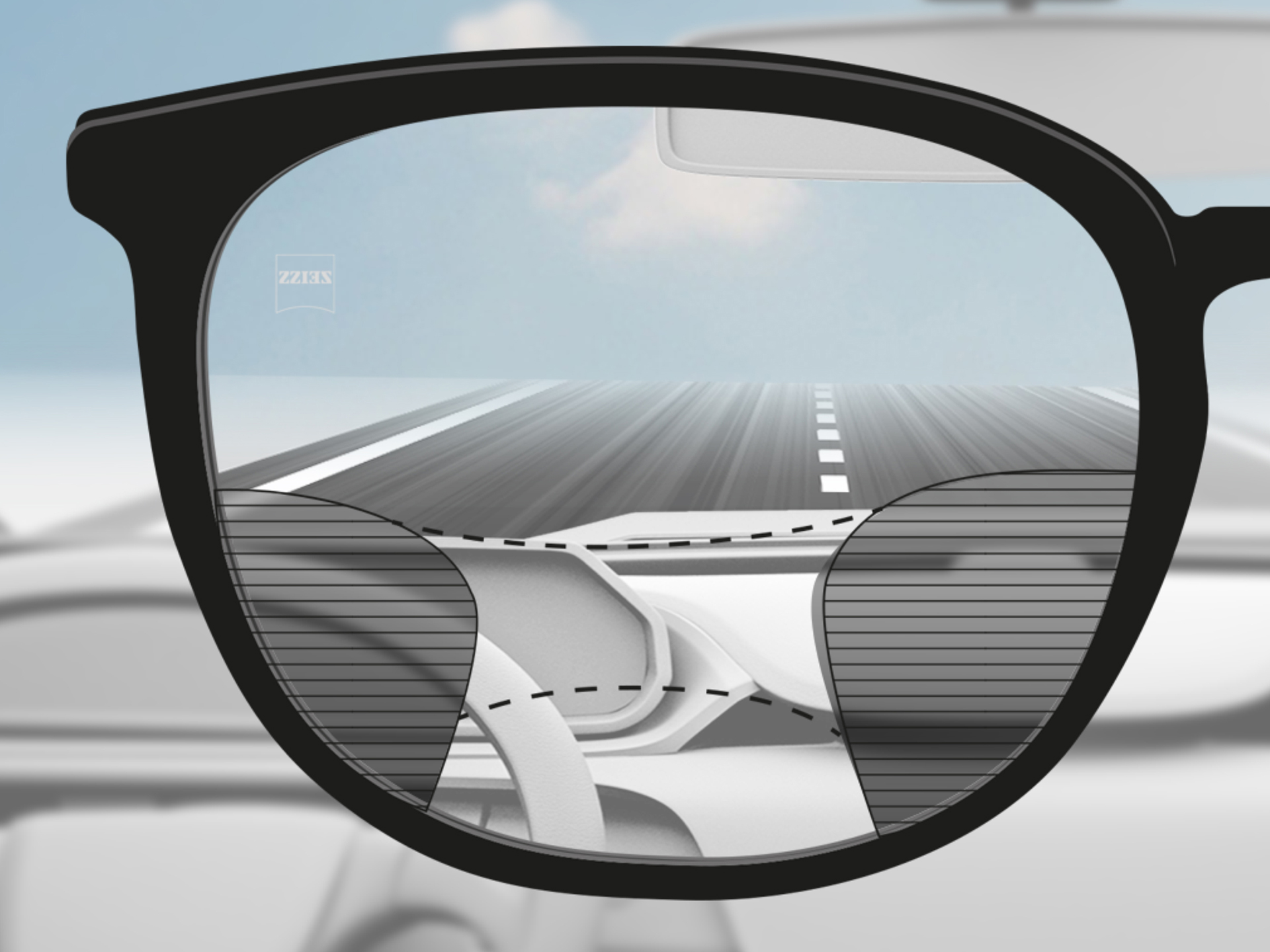 Une image montrant le point de vue à travers un verre ZEISS Progressive DriveSafe : les zones de vision sont adaptées de sorte à ce que le conducteur ait des zones de vision nette au niveau de la route et du tableau de bord.