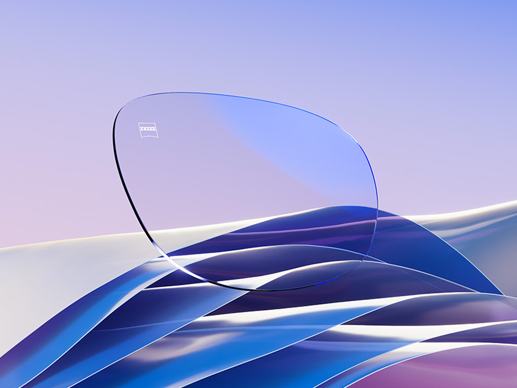 A CGI representation of a clear eyeglass lens with a subtle blue reflex.