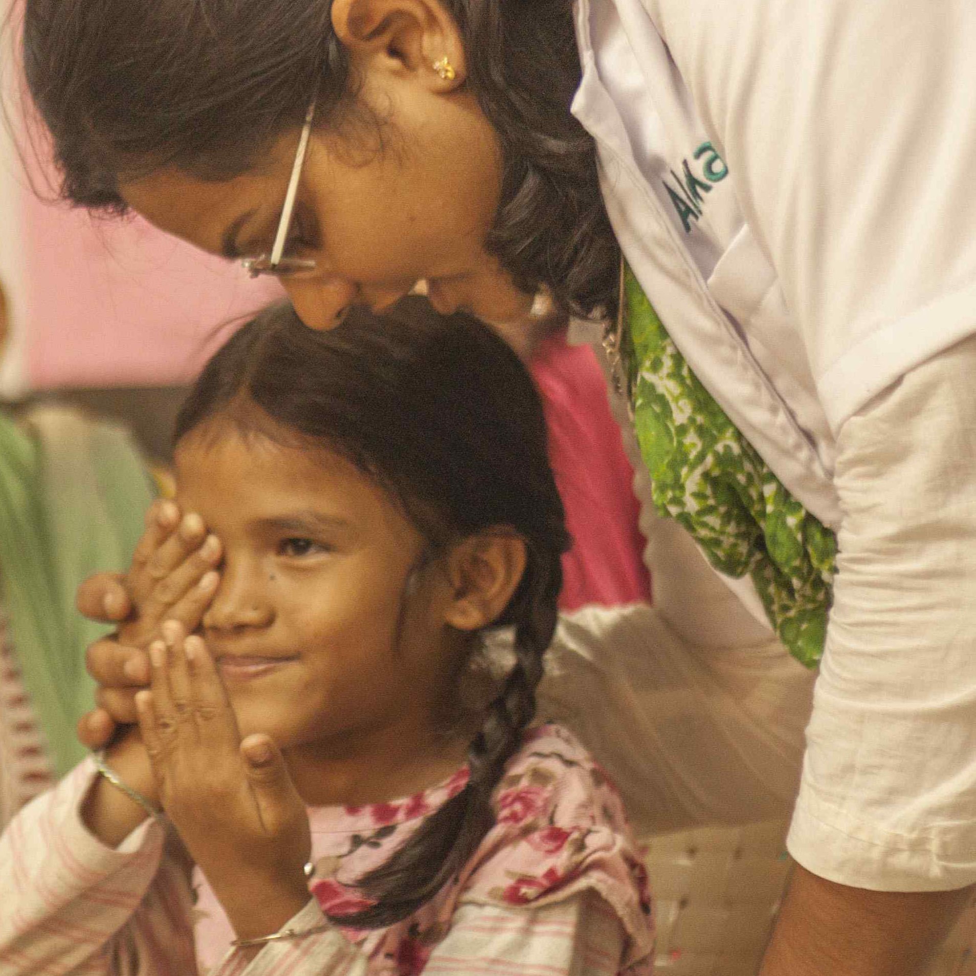 Aloka vision programme woman is testing a girls eyes