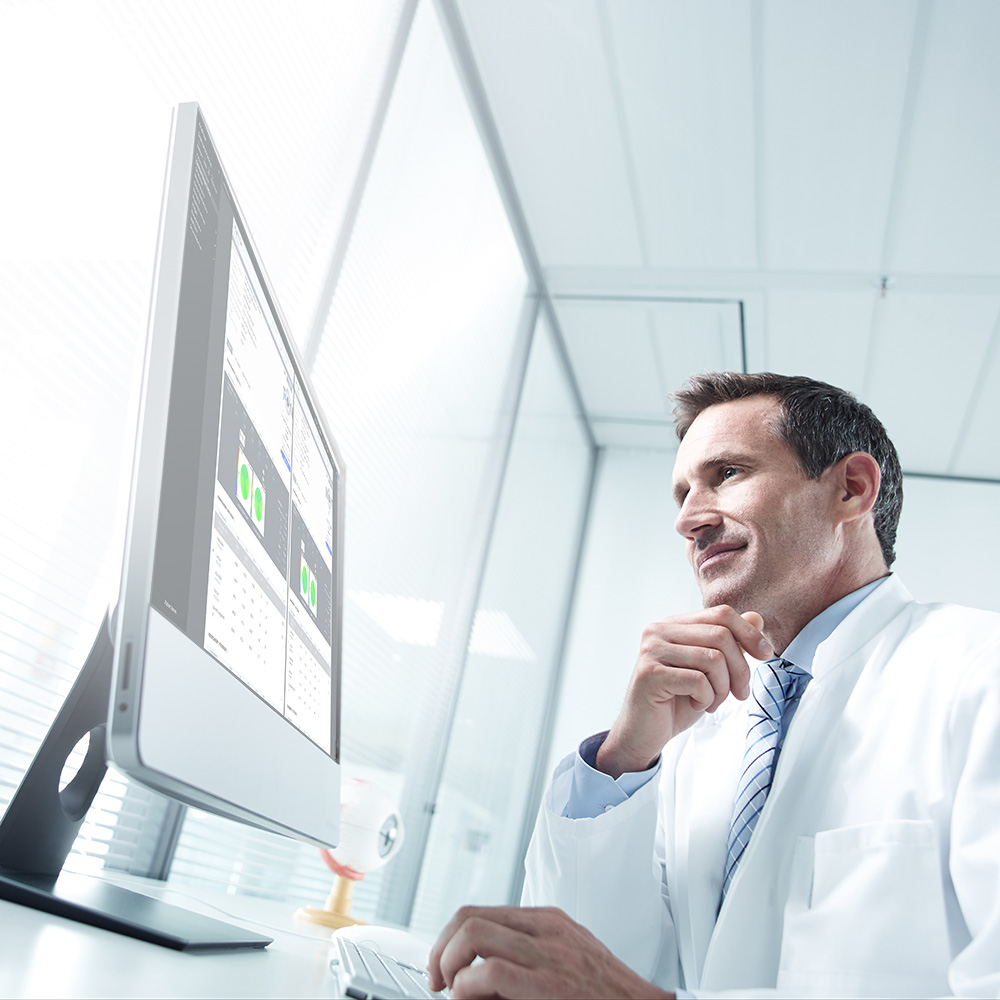 A doctor using the program on a computer