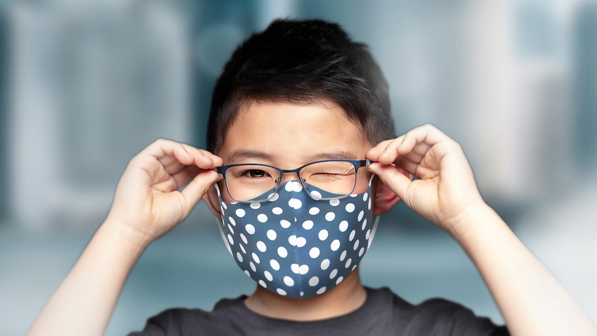A boy wearing a mask with clear glasses