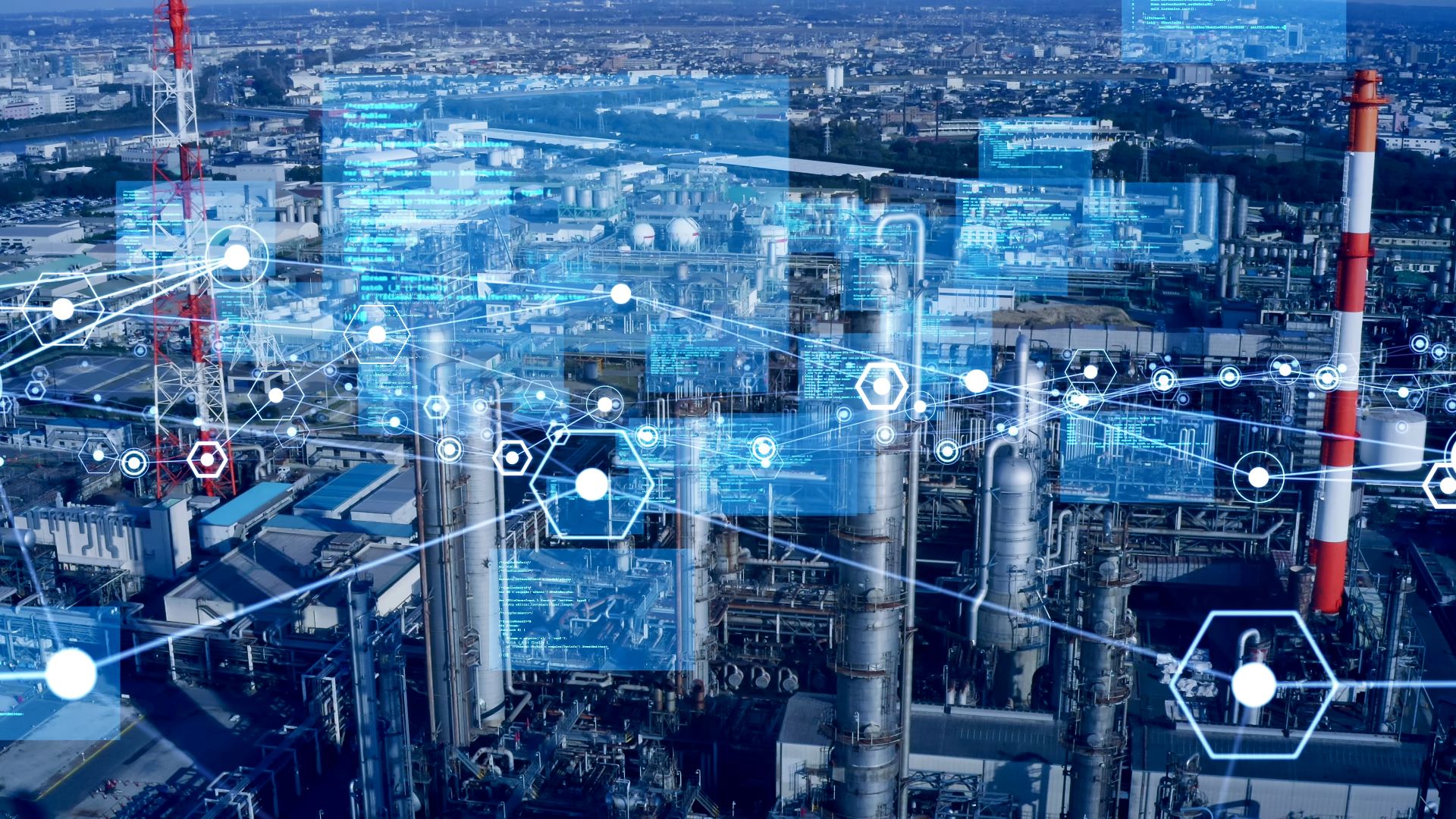 Industrial landscape with multiple factories and digital interface overlays representing data and connectivity, illustrating ZEISS technology integration.